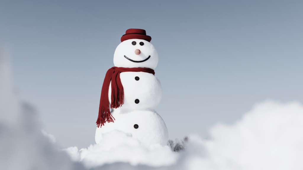 An snowman smiling to depict the metaphor the ice cube that became the snowman that shows you how to stop stressing