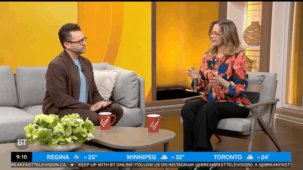 Breakfast television host Tim Bolen and Allison Graham sitting on the set from BT in chairs talking